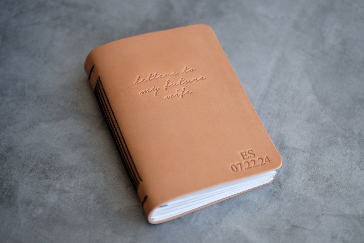 Custom hand-bound leather journal with embossed initials